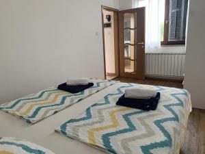 Postelja oz. postelje v sobi nastanitve White apartments Hrvatini
