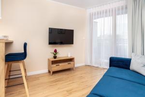 Televízia a/alebo spoločenská miestnosť v ubytovaní Apartment Awanport Gdynia Żeromskiego by Noclegi Renters