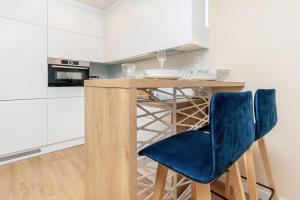 Kuchyňa alebo kuchynka v ubytovaní Apartment Awanport Gdynia Żeromskiego by Noclegi Renters