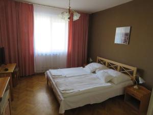 Postel nebo postele na pokoji v ubytování Thermál Apartmanház