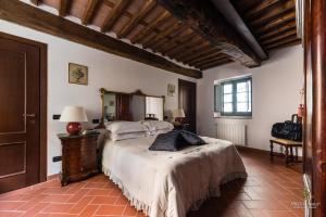 Postel nebo postele na pokoji v ubytování Tenuta Guinigi Antico Borgo di Matraia - Exclusive Holidays apartments & Pool + 127 fotografií
