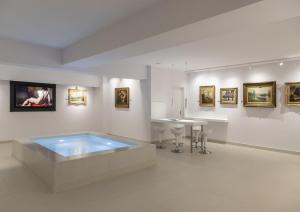 TV a/nebo společenská místnost v ubytování Gallery Suites & Residences Piraeus