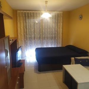 Postel nebo postele na pokoji v ubytování TU CASA EN MEQUINENZA CON WIFI