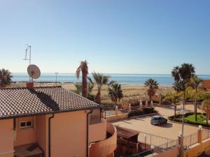 a view of the beach from the roof of a building at Baciati Dal Sole in Porto Empedocle