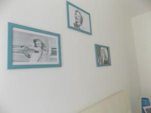 un gruppo di immagini su un muro bianco di L'orchidea amalfi coast a Maiori