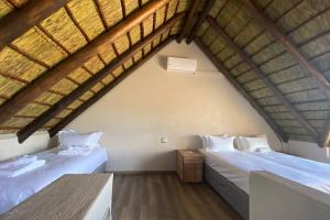 Ένα ή περισσότερα κρεβάτια σε δωμάτιο στο Gweda Lodge Mabalingwe Nature Reserve +34 φωτογραφίες