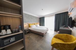 Voodi või voodid majutusasutuse Ivy Hotel - Adults Only toas