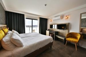 Voodi või voodid majutusasutuse Ivy Hotel - Adults Only toas