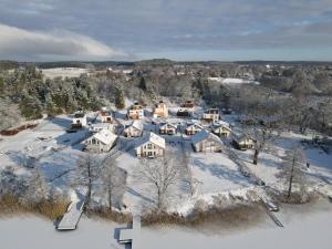 an aerial view of a house in the snow at Naturpark-5 Sterne Ferienhaus-Kamin-Sauna-See in Krakow am See
