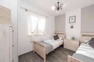 Posteľ alebo postele v izbe v ubytovaní Villa Kirstin + 34 fotografií