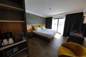 Voodi või voodid majutusasutuse Ivy Hotel - Adults Only toas