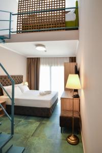 Postel nebo postele na pokoji v ubytování Hotel Palladium Sithonia