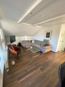 a living room with a couch and a table at Ferienwohnung "Am Wald 1" in Boppard