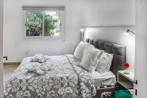 
a bedroom with a bed and a window at Artemis Cynthia Complex in Paphos City
