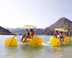 a group of people riding on an inf paddle boat in the water at Departamento en San Juan, Argentina in San Juan
