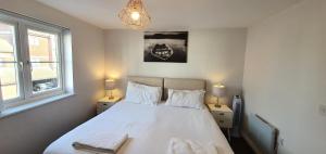 Ένα ή περισσότερα κρεβάτια σε δωμάτιο στο Garland Modern Apartment Tilbury with Parking