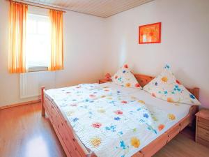 Un pat sau paturi într-o cameră la Ferienhof Kassandra