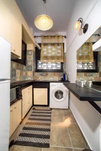 a laundry room with a washing machine in it at Acropolis Area Flat in Athens