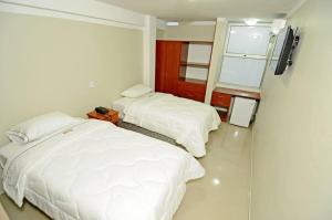 Postel nebo postele na pokoji v ubytování Hotel Plaza Sullana