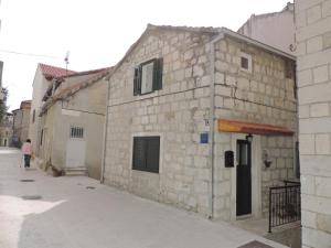 an old stone building on the side of a street at Apartments Lana in Split