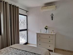 Łóżko lub łóżka w pokoju w obiekcie CAPISTRANO PUEBLO 106A Menyber