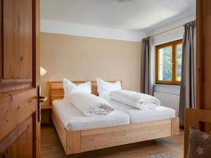 Postel nebo postele na pokoji v ubytování Haus Ausblick