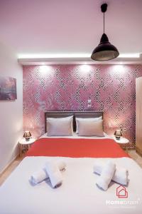 Ένα ή περισσότερα κρεβάτια σε δωμάτιο στο Cozy City Suite