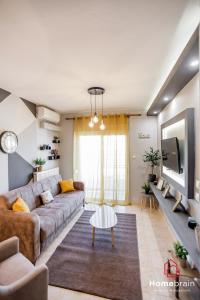 Χώρος καθιστικού στο Cozy City Suite