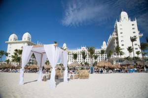 a beach with a large white tent on top of it at Riu Palace Aruba - All Inclusive in Palm-Eagle Beach
