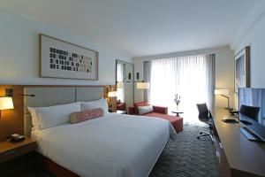 a hotel room with a large bed and a desk at Hotel Real Intercontinental Tegucigalpa, an IHG Hotel in Tegucigalpa