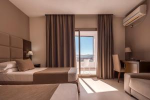 Postel nebo postele na pokoji v ubytování Hotel Omeya + 24 fotografií