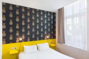 Un ou plusieurs lits dans un hébergement de l'établissement Hôtel Marsiho by HappyCulture - ex Best Western Marseille