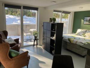 a bedroom with a bed and a desk and chairs at B&B 't Onderkomen in 't Harde
