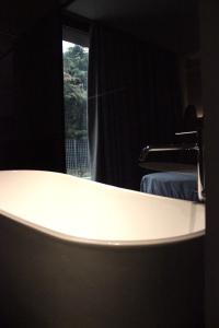 a bathroom with a white sink and a window at Bv hotel in Brignano Gera dʼAdda