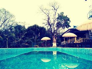 The swimming pool at or close to Ixzire Port Blair Resort