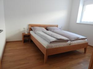 En eller flere senge i et værelse på Ferienwohnung im Stern