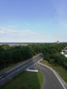 an empty road with a car driving down it at студио Маргрете in Burgas City