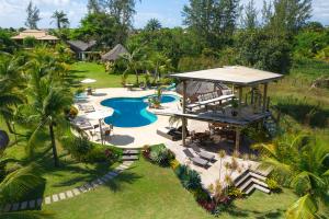 an aerial view of a resort pool with a gazebo at Pousada Barrabella in Barra Grande