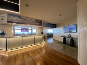 a large room with a display case in a building at Barion Hotel & Congressi in Bari