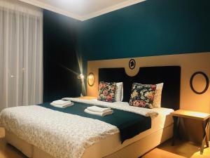 Un pat sau paturi într-o cameră la Villa La Via ***