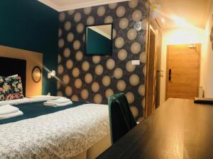 A bed or beds in a room at Villa La Via ***