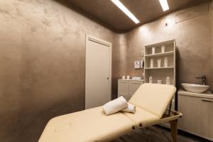 a hospital room with a bed and a sink at Barion Hotel & Congressi in Bari