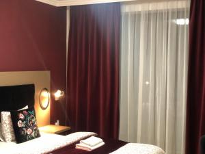 A bed or beds in a room at Villa La Via ***