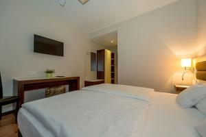 Postel nebo postele na pokoji v ubytování Hotel Nordhausen