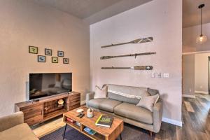 a living room with a couch and a tv at Buena Vista Condo, Less Than half Mile to River and Main St! in Buena Vista