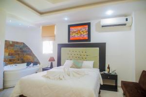 Voodi või voodid majutusasutuse Hotel Presidente Beach Salinas toas