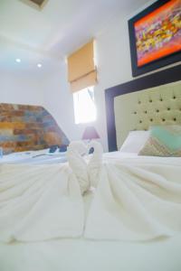 Voodi või voodid majutusasutuse Hotel Presidente Beach Salinas toas