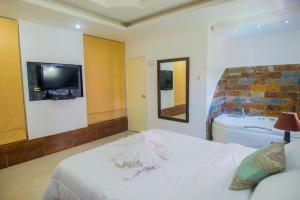 Voodi või voodid majutusasutuse Hotel Presidente Beach Salinas toas