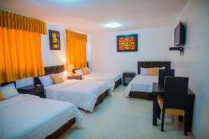 Voodi või voodid majutusasutuse Hotel Presidente Beach Salinas toas