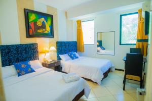 Voodi või voodid majutusasutuse Hotel Presidente Beach Salinas toas